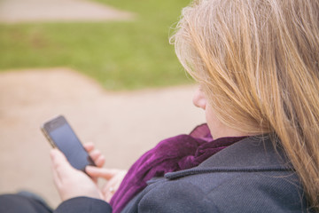 Women looking at her Smart Phone