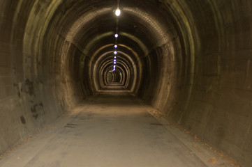Fototapeta na wymiar Alpe Adria cycling road tunnel, old railway, underground