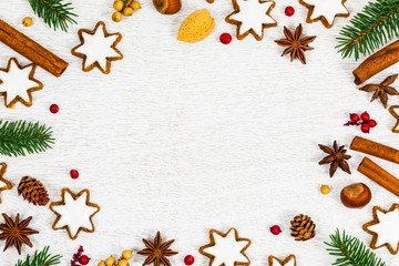 Christmas Background with Star Gingerbread Cookies and Holiday Decorations on White Wooden Background with Space for Text