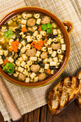 Soup with Meatballs, Carrots and Spinach in Chicken Broth. Selective focus. 
