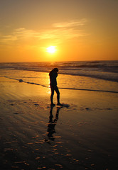 silhouette of woman at sunset