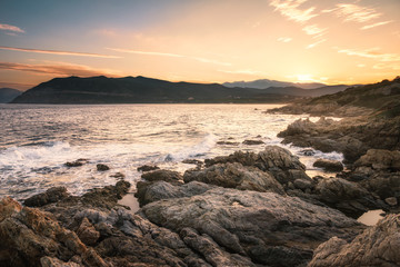 Obraz premium Sunrise on the rocky coast of Corsica