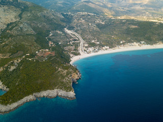 Fototapeta na wymiar Aerial view of beautiful tropical Mediterranean beach in Himara, Albania (Albanian Riviera, Livadhi Beach)