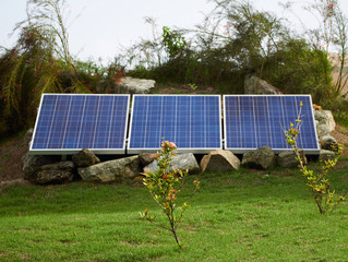 Solar panel on a beautiful green lawn