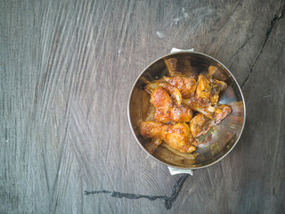 Selective focus the delicious meal consists of Chicken Oyster Sauce on the top of wooden table.