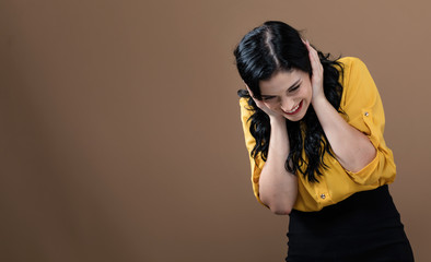 Fototapeta premium Happy young woman on a solid background