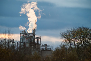 Industriel smoke release  from factory chiminy in a rural area