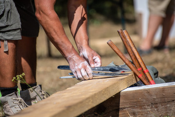 A man is ready for throwing a knife on competition.