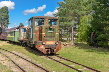 Fototapeta na wymiar old rusty train on the narrow gauge near Pereslavl-Zalessky, Yaroslavl region, Russia