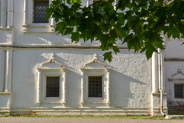windows on white facade of All Saints Church in Goritsky Monastery of Dormition Pereslavl-Zalessky,...