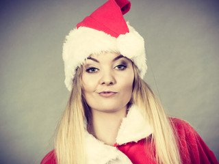 Dissatisfied woman wearing Santa Claus helper costume