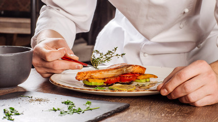 Preparation of dishes by a chef in a restaurant..