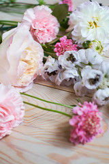 young flowers on rustic wooden boards background