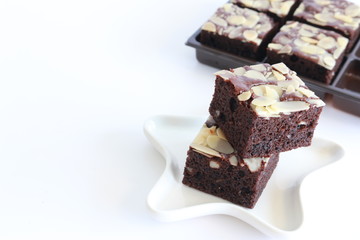 delicious brownies in white plate on white background, homemade brownies , sweet dessert in...
