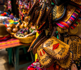 Fototapeta premium Different leather and fabric handbags on the souvenir store in Bolivia