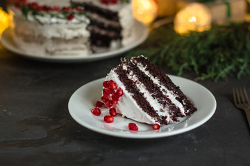 chocolate cake with pomegranate and rosemary (the cake is creamy with chocolate). top view.