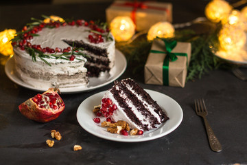 chocolate cake with pomegranate and rosemary (the cake is creamy with chocolate). top view.