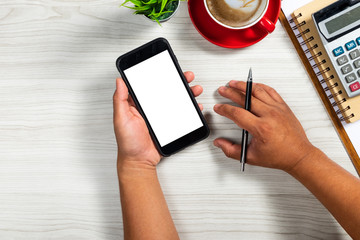 Man using smartphone in shopping mall space background and copy space. Blank screen for graphics display montage.