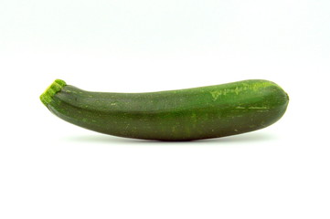 Green courgette or zucchini against a white background.