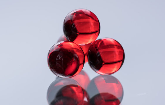 Small red medicine capsules containing nitroglycerin, validol