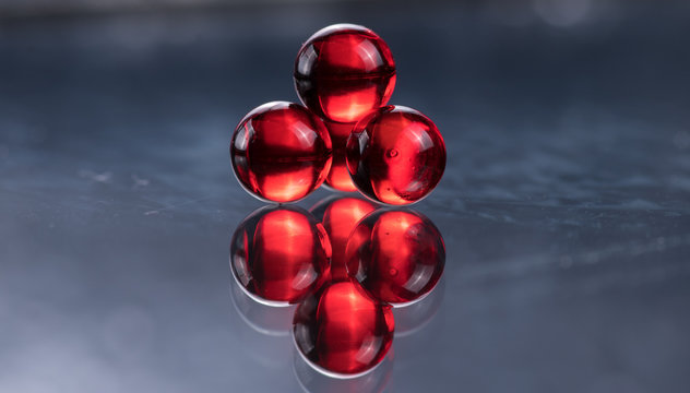 Small red medicine capsules containing nitroglycerin, validol