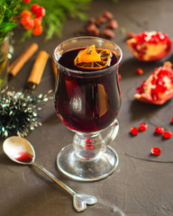 Mulled wine with spices and gifts on the table. Happy New Year! Top view