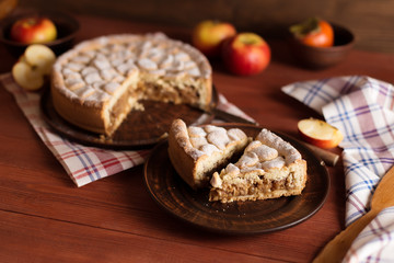 Homemade apple pie on a wooden table.