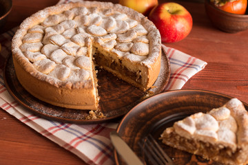 Homemade apple pie on a wooden table.