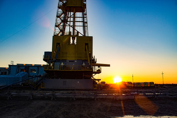 rig on sunset background