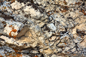 The texture of the stone close-up with streaks.