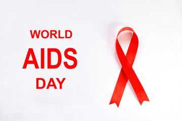 Red ribbon on white background. World Aids Day concept