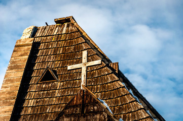 Fototapeta na wymiar Cross at the top of the church roof