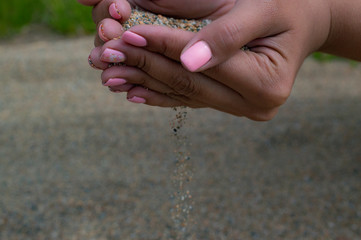 sand falls from hands beautifully