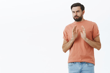 Guy refusing try meal being stuffed, holding hands near chest in rejection and no gesture, turning...