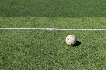 Football on artificial turf. It is for green background in a stadium
