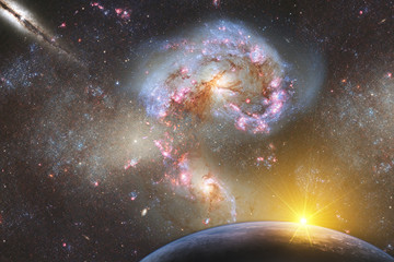 fantastic landscape of space with a planet on a background of galaxies with a reflection of the rays of the sun. Elements of this image furnished by NASA.