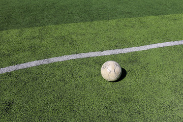 Football on artificial turf. It is for green background in a stadium
