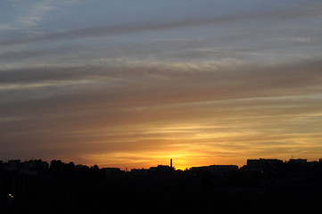 Fototapeta na wymiar Magical view of gorgeous sunset over cityscape