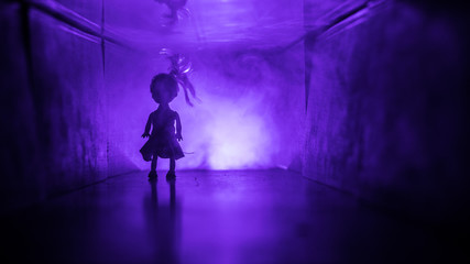 Obraz premium Creepy silhouette in the dark abandoned building. Horror about maniac concept or Dark corridor with cabinet doors and lights with silhouette of spooky horror person