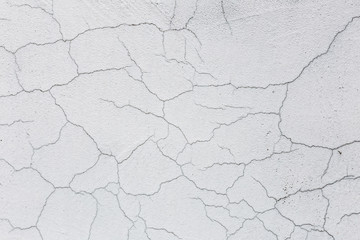 Texture of white dirty cracked wall. Small straight cracks. Direct fracture on painted surface. Cells fissure