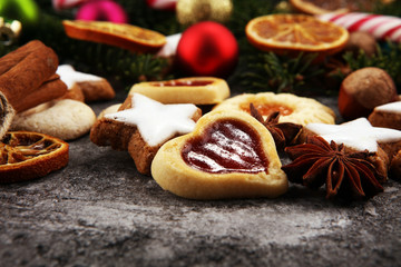 Decoration with christmas cookies. Typical cinnamon stars with fruits and nuts
