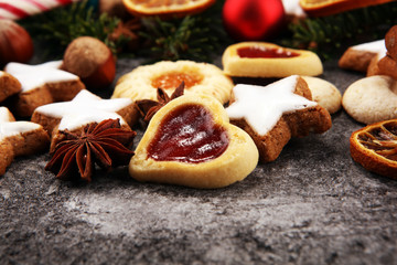 Decoration with christmas cookies. Typical cinnamon stars with fruits and nuts