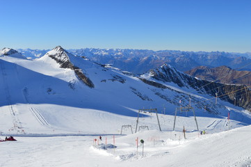 Fototapeta na wymiar View at snowy mountains at ski area