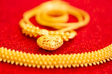 Thai gold jewelry 96.5% set on red carpet texture for sell