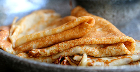 Macro photo of delicious pancakes with honey