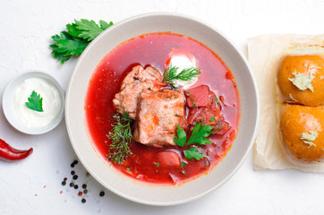Borscht, Red Soup Made of Beetroot and Vegetables with Pork Ribs and Sour Cream Served with Garlic Rolls, Ukrainian, Russian and Polish Traditional Dish