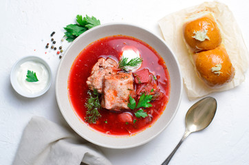 Borscht, Red Soup Made of Beetroot and Vegetables with Pork Ribs and Sour Cream Served with Garlic Rolls, Ukrainian, Russian and Polish Traditional Dish