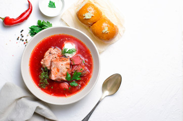Borscht, Red Soup Made of Beetroot and Vegetables with Pork Ribs and Sour Cream Served with Garlic Rolls, Ukrainian, Russian and Polish Traditional Dish