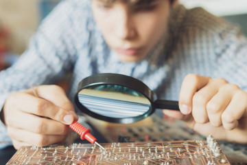 man engineer repair computer board in the workshop f