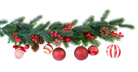 Christmas garland with red and white hanging balls, cones and berries on isolated white background